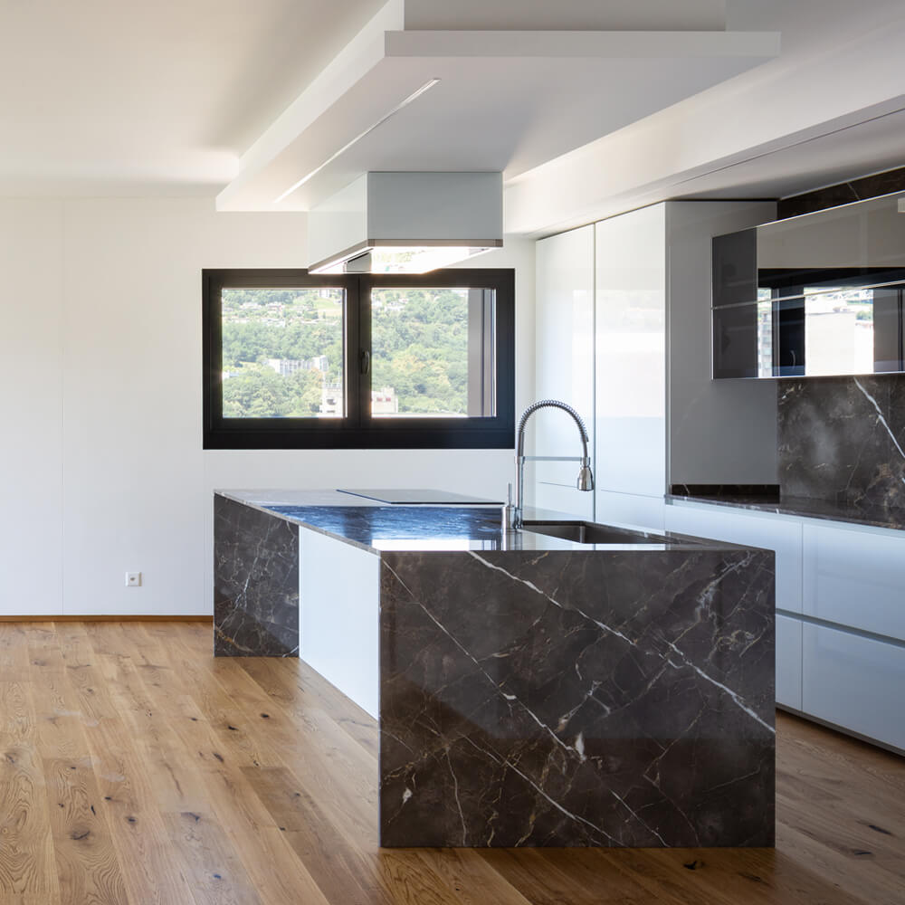 Marble kitchen with custom backsplash
